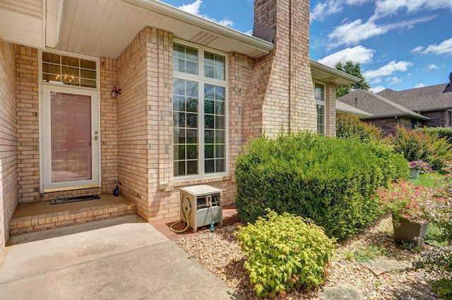2133 E Cragmont St, Springfield, MO 65804 - entrance to property featuring a chimney and brick siding