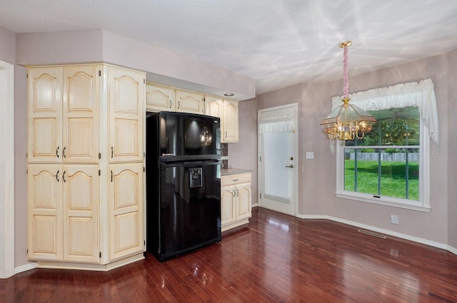 2133 E Cragmont St, Springfield, MO 65804 - kitchen with freestanding refrigerator, cream cabinetry, a chandelier, and dark wood-style floors