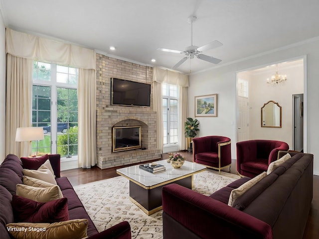 2133 E Cragmont St, Springfield, MO 65804 - living room with ornamental molding, healthy amount of natural light, wood finished floors, a ceiling fan, and recessed lighting