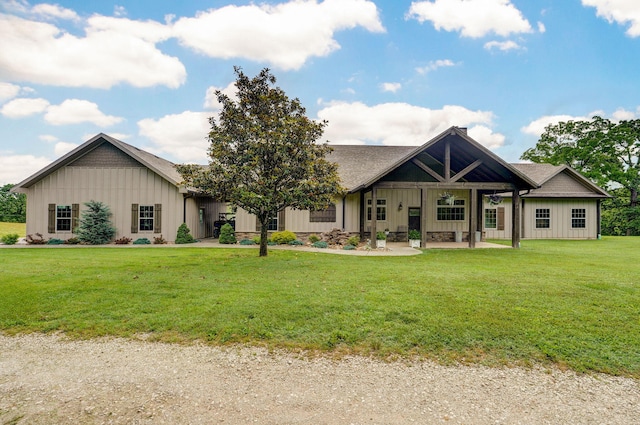 1721 Jackson Spring Rd, Ozark, MO 65721 - view of front of home featuring board and batten siding and a front yard