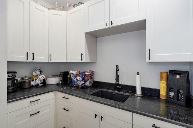 1721 Jackson Spring Rd, Ozark, MO 65721 - kitchen with white cabinets and dark stone countertops