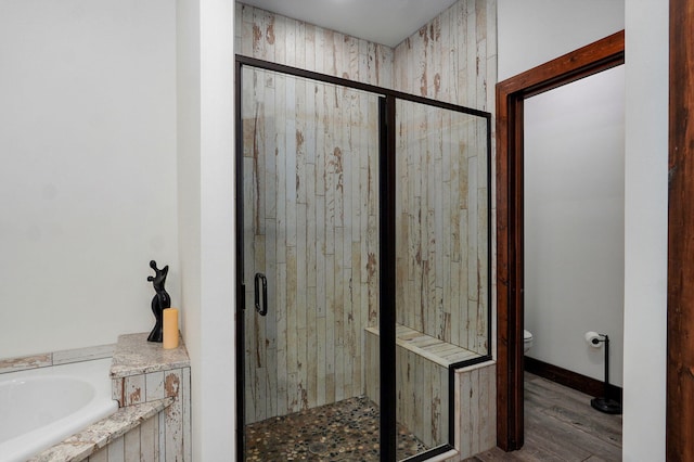 1721 Jackson Spring Rd, Ozark, MO 65721 - bathroom with a shower stall, a garden tub, and wood finished floors