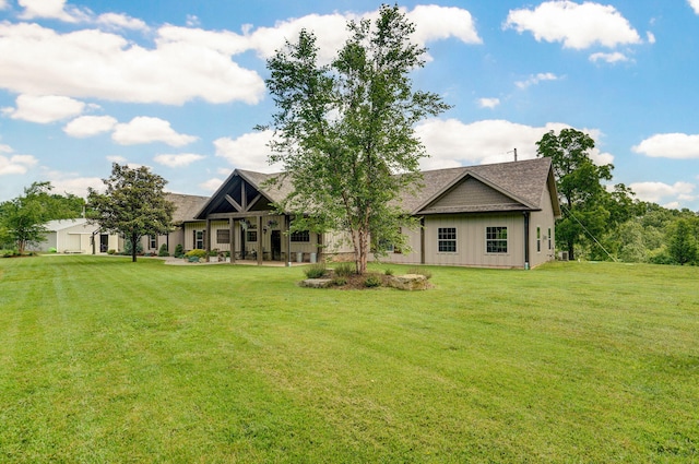 1721 Jackson Spring Rd, Ozark, MO 65721 - back of property with a yard, board and batten siding, and a shingled roof