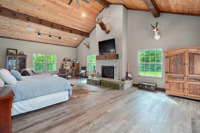 1721 Jackson Spring Rd, Ozark, MO 65721 - bedroom featuring a wood ceiling with exposed beams, hardwood / wood-style floors, a fireplace, and high vaulted ceiling