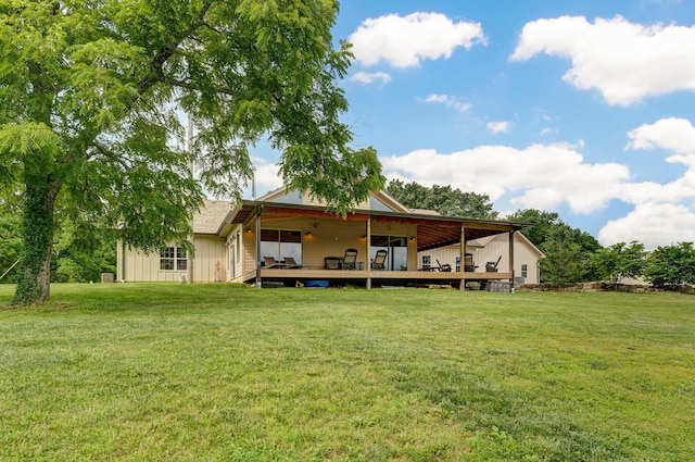1721 Jackson Spring Rd, Ozark, MO 65721 - rear view of house with a deck, a yard, and board and batten siding