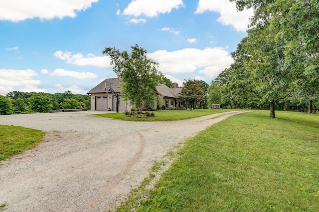 1721 Jackson Spring Rd, Ozark, MO 65721 - view of front facade featuring a front yard, curved driveway, and an attached garage