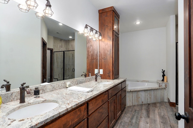 1721 Jackson Spring Rd, Ozark, MO 65721 - full bath with wood finished floors, a garden tub, double vanity, and a shower stall
