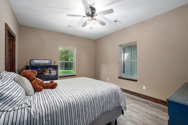 1721 Jackson Spring Rd, Ozark, MO 65721 - bedroom with light wood-style flooring and a ceiling fan