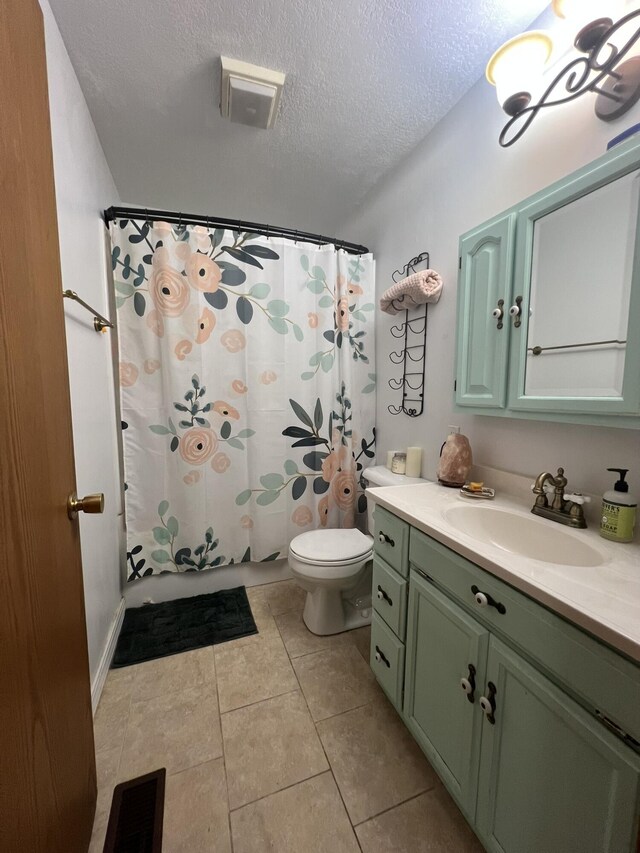1014 Sassafras St, Willow Springs, MO 65793 - bathroom featuring vanity, a textured ceiling, and tile patterned flooring