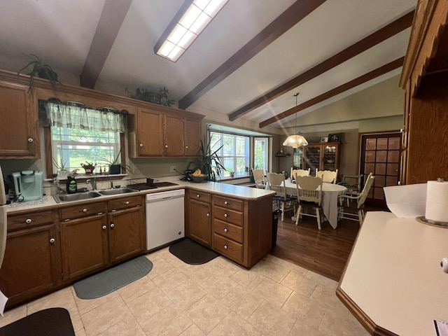 1014 Sassafras St, Willow Springs, MO 65793 - kitchen featuring dishwasher, a peninsula, light countertops, and decorative light fixtures