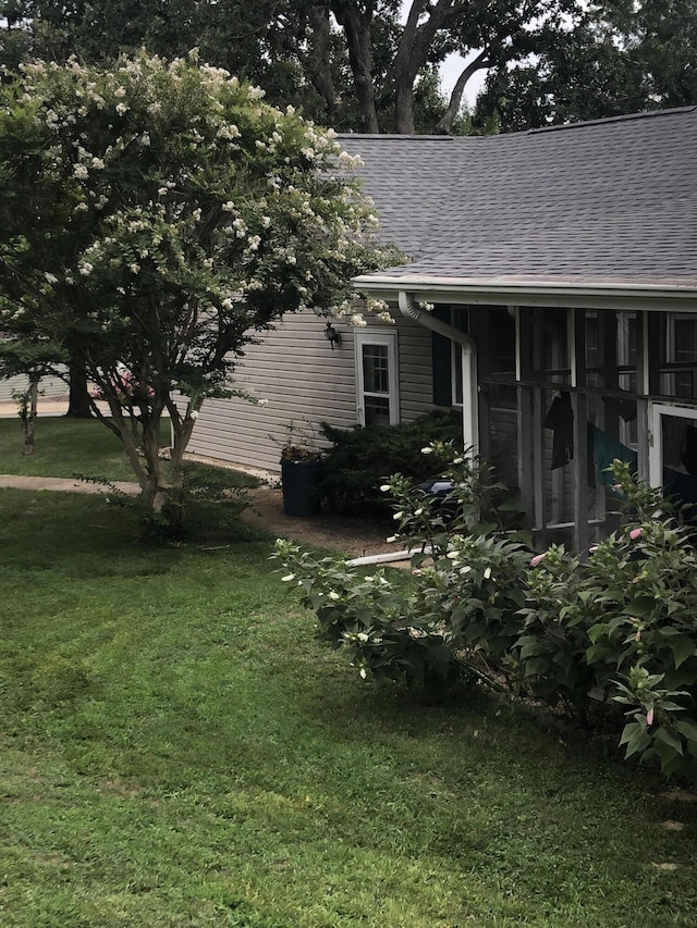 1014 Sassafras St, Willow Springs, MO 65793 - view of property exterior featuring roof with shingles and a lawn