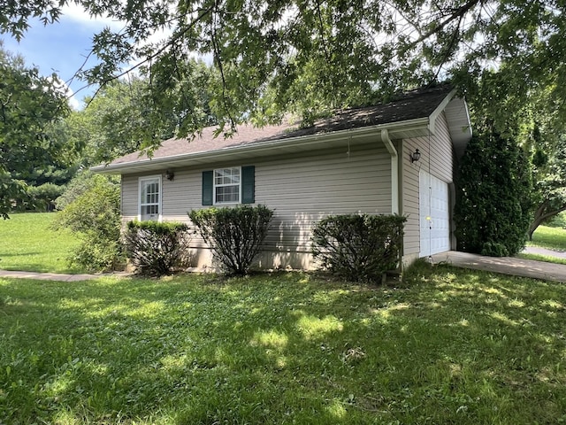 1014 Sassafras St, Willow Springs, MO 65793 - view of home's exterior with an attached garage and a lawn