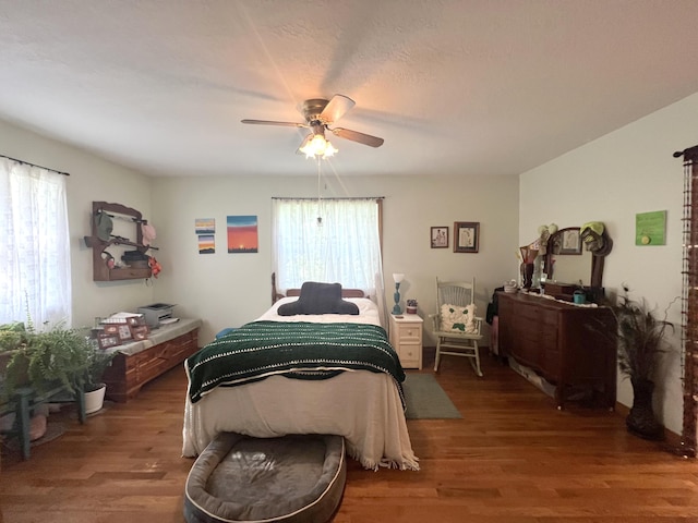 1014 Sassafras St, Willow Springs, MO 65793 - bedroom featuring multiple windows, wood finished floors, and ceiling fan