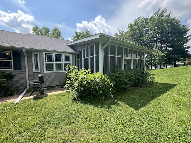 1014 Sassafras St, Willow Springs, MO 65793 - back of house with a sunroom, a lawn, and a shingled roof