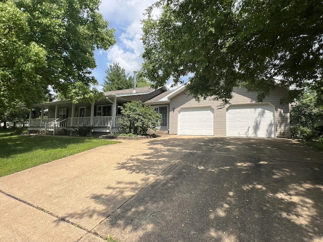 1014 Sassafras St, Willow Springs, MO 65793 - view of front of house with driveway, an attached garage, a porch, and a front lawn