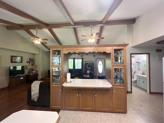 1014 Sassafras St, Willow Springs, MO 65793 - kitchen featuring ceiling fan, glass insert cabinets, light countertops, and open floor plan