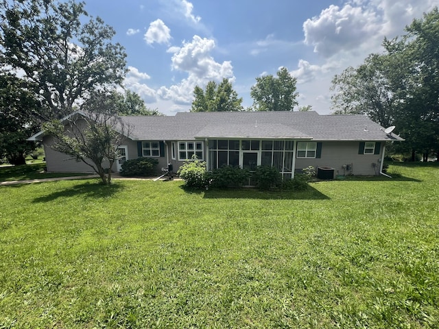1014 Sassafras St, Willow Springs, MO 65793 - rear view of property featuring a lawn, a sunroom, and a shingled roof
