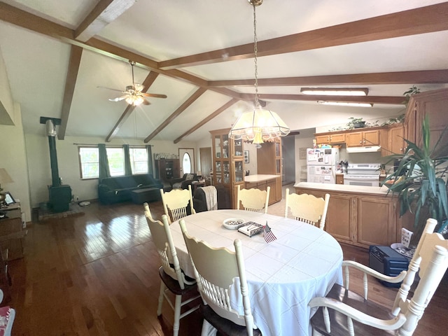 1014 Sassafras St, Willow Springs, MO 65793 - dining area featuring wood finished floors, a wood stove, and ceiling fan