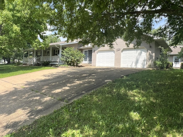 1014 Sassafras St, Willow Springs, MO 65793 - single story home featuring asphalt driveway, covered porch, a garage, and a front yard