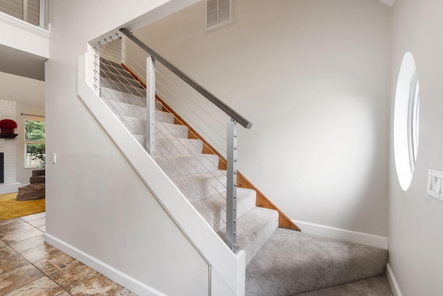 3115 E Lark St, Springfield, MO 65804 - stairway with baseboards and a fireplace