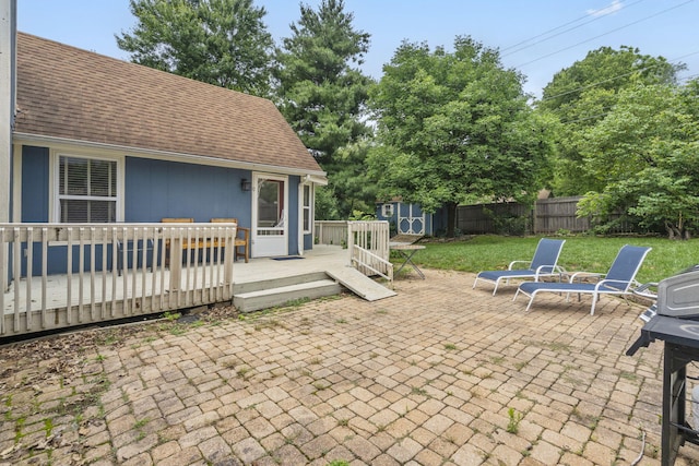 3115 E Lark St, Springfield, MO 65804 - view of patio featuring a storage unit and a deck