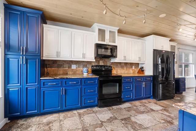 3115 E Lark St, Springfield, MO 65804 - kitchen with black appliances, blue cabinets, decorative backsplash, light stone counters, and white cabinetry