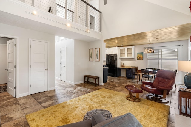 3115 E Lark St, Springfield, MO 65804 - living room featuring a towering ceiling and stone finish flooring