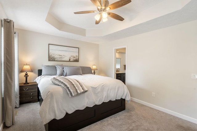 3115 E Lark St, Springfield, MO 65804 - bedroom with light colored carpet, a raised ceiling, ensuite bath, and ceiling fan