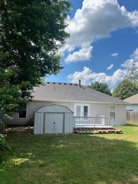 2004 Candace St, Ozark, MO 65721 - rear view of property featuring a storage unit, a wooden deck, and a shingled roof