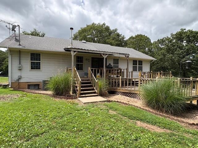 21572 Lawrence Unit 1240, Aurora, MO 65605 - rear view of property with a lawn and a wooden deck