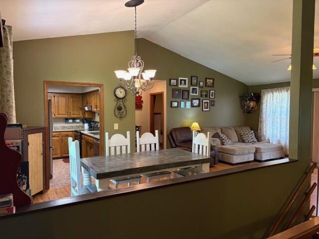 21572 Lawrence Unit 1240, Aurora, MO 65605 - dining room featuring lofted ceiling, a ceiling fan, and a chandelier