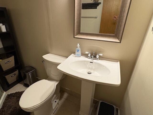 21572 Lawrence Unit 1240, Aurora, MO 65605 - bathroom featuring toilet and tile patterned flooring