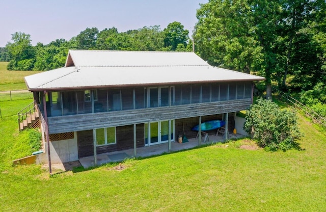4949 S 196th Rd, Halfway, MO 65663 - rear view of house with a sunroom, a yard, and a patio