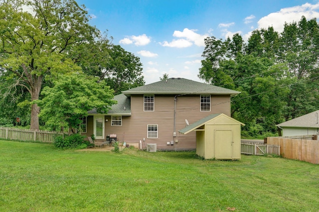 5911 S Farm Rd Unit 157, Springfield, MO 65810 - back of house featuring a shed, a fenced backyard, and a shingled roof