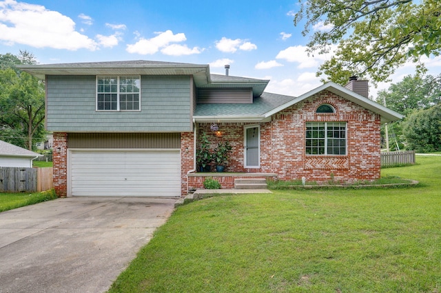 5911 S Farm Rd Unit 157, Springfield, MO 65810 - tri-level home featuring brick siding, a garage, driveway, and a chimney