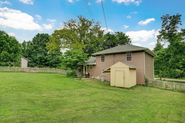 5911 S Farm Rd Unit 157, Springfield, MO 65810 - fenced backyard featuring a storage unit and view of wooded area