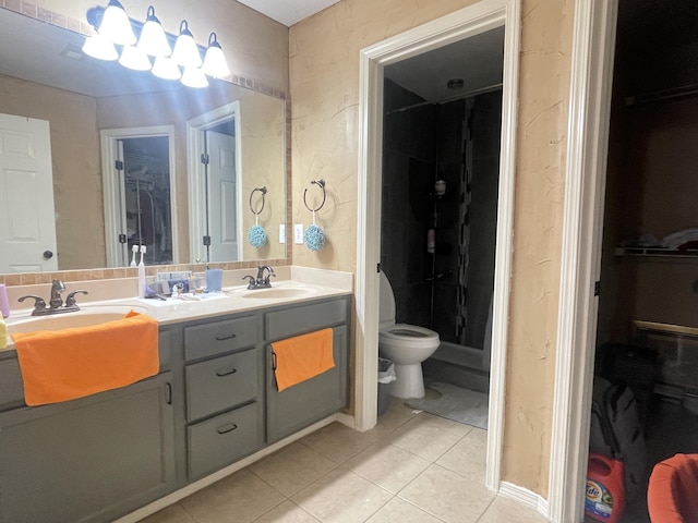 718 S Ridgecrest Ave, Nixa, MO 65714 - bathroom with tile patterned flooring, a spacious closet, and double vanity
