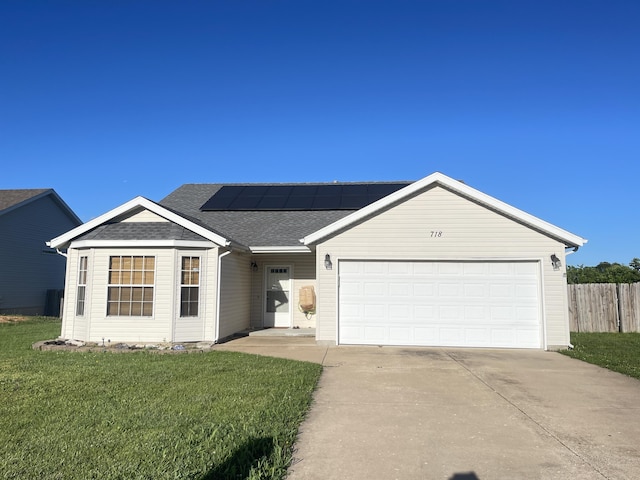 718 S Ridgecrest Ave, Nixa, MO 65714 - single story home with solar panels, concrete driveway, a garage, and roof with shingles