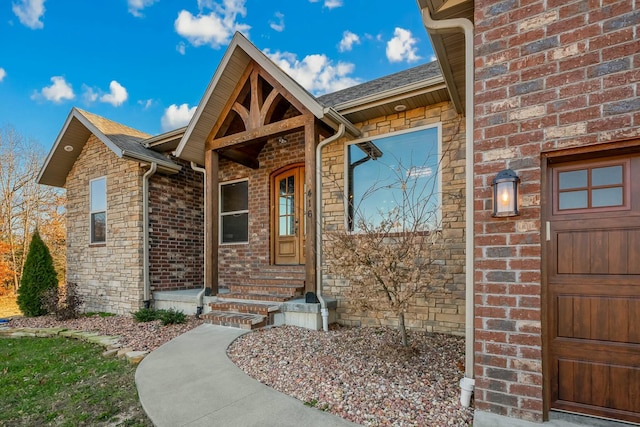 416 W Saddle Club Rd, Fair Grove, MO 65648 - property entrance with stone siding, a shingled roof, a garage, and brick siding