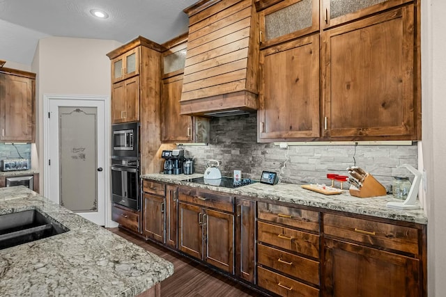 416 W Saddle Club Rd, Fair Grove, MO 65648 - kitchen featuring black appliances, decorative backsplash, light stone counters, dark wood-style flooring, and glass insert cabinets