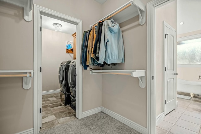 416 W Saddle Club Rd, Fair Grove, MO 65648 - laundry room featuring washing machine and dryer and tile patterned floors