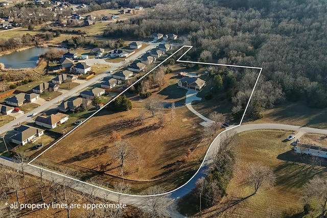 416 W Saddle Club Rd, Fair Grove, MO 65648 - aerial perspective of suburban area with a forest and property parcel outlined