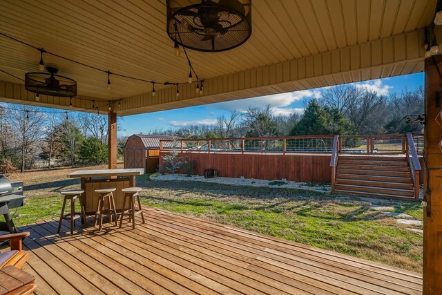416 W Saddle Club Rd, Fair Grove, MO 65648 - wooden terrace with a shed, ceiling fan, and outdoor dining area