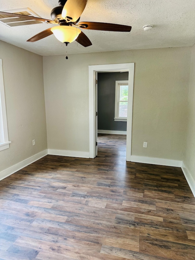 652 W Hovey St, Springfield, MO 65802 - empty room with a ceiling fan, wood finished floors, and a textured ceiling