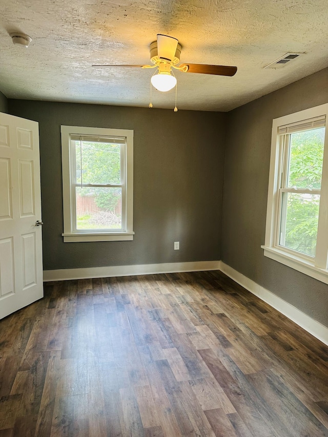 652 W Hovey St, Springfield, MO 65802 - unfurnished room featuring a smoke detector, dark wood-style flooring, ceiling fan, and a textured ceiling