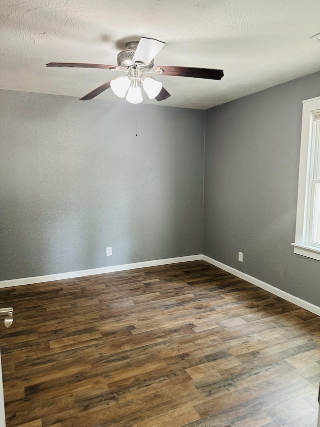 652 W Hovey St, Springfield, MO 65802 - unfurnished room featuring dark wood-style floors and ceiling fan