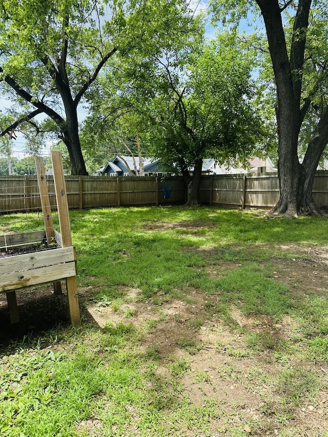652 W Hovey St, Springfield, MO 65802 - fenced backyard featuring a garden