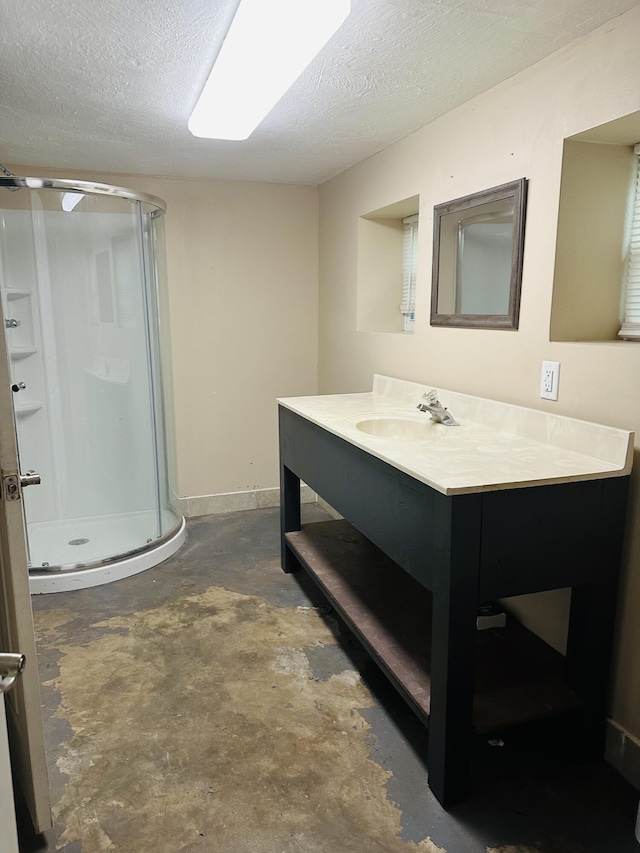 652 W Hovey St, Springfield, MO 65802 - bathroom with a stall shower, concrete flooring, vanity, and a textured ceiling