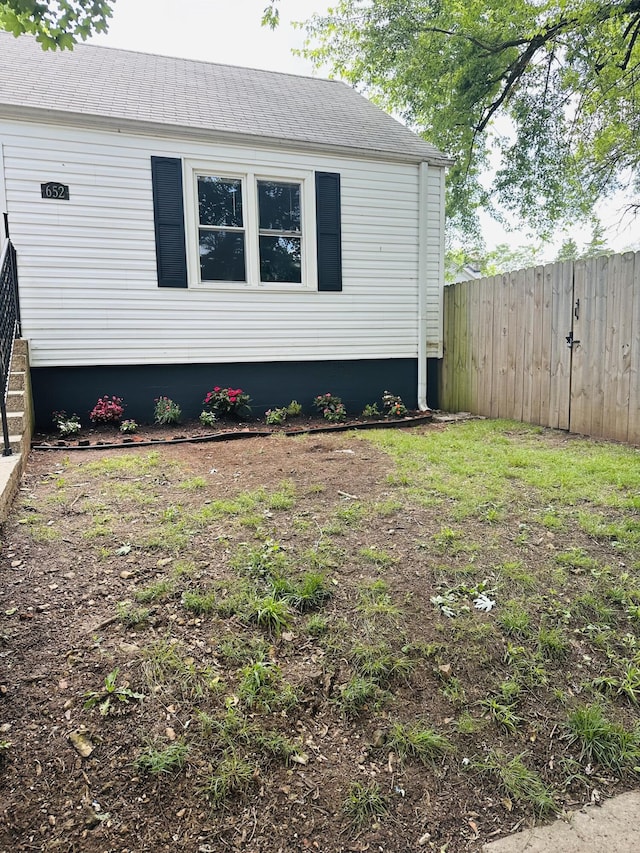 652 W Hovey St, Springfield, MO 65802 - view of home's exterior featuring a shingled roof