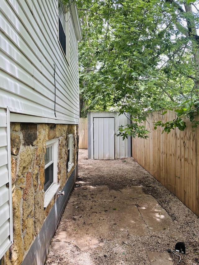 652 W Hovey St, Springfield, MO 65802 - fenced backyard featuring a storage unit